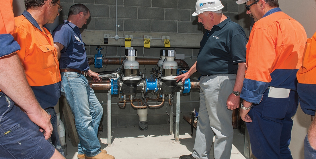 armidale-hospital-commissioning-3 6 people in hi vid tops looking at commercial backwash filters