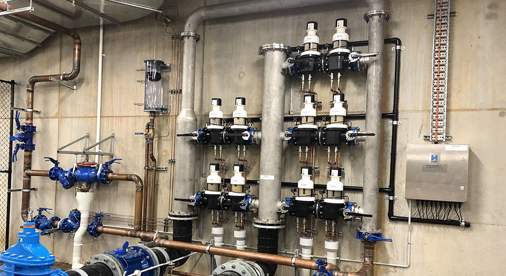 western-sydney-stadium-judo Photo of backwash filters on the wall of a plant room