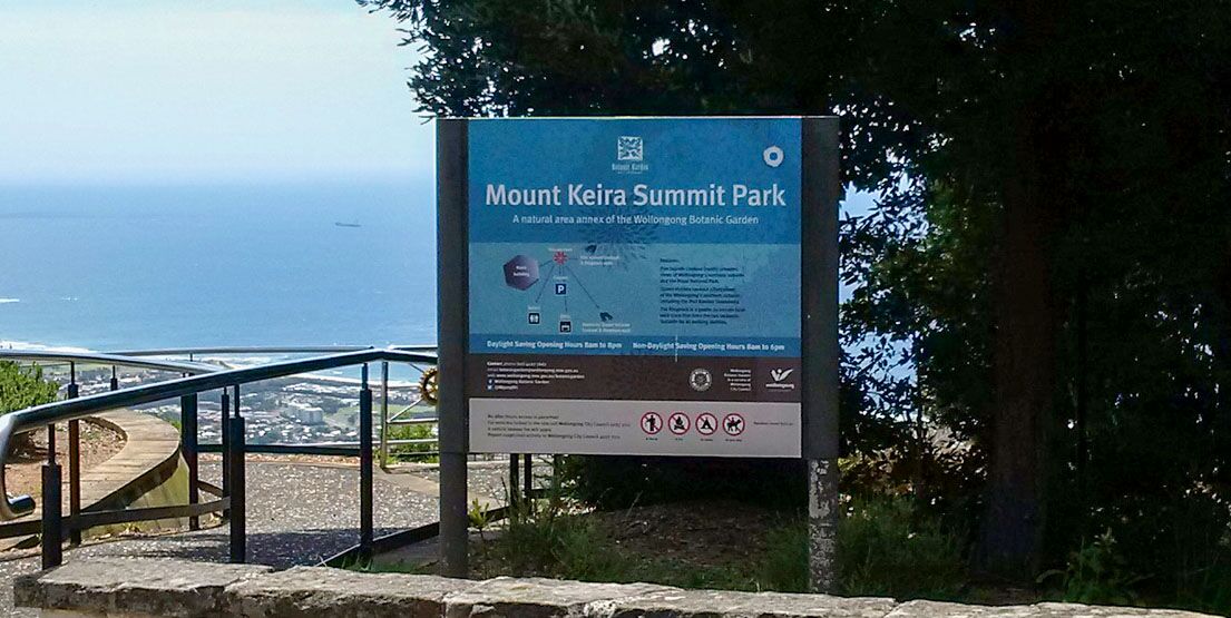 mt-keira-lookout View of Mout Keira summit park sign and view out to sea