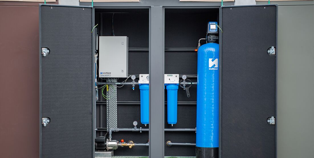 hunter water potable water installation 5 big container with open doors showing water filtration system