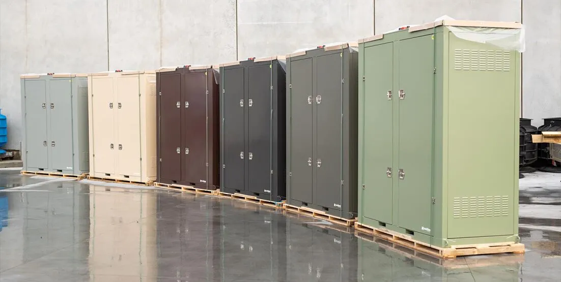 hunter water remote nsw 1 Line up of 5 containerised water treatements systems in a semi circle in a large warehouse space.