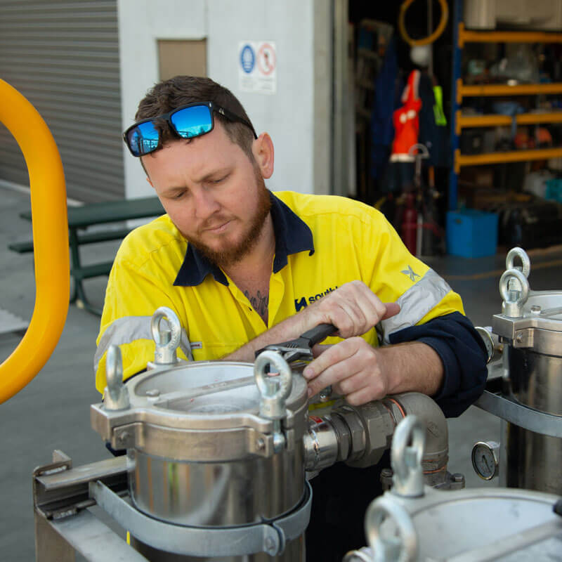 Southland Filtration Technician working on a water filtration system