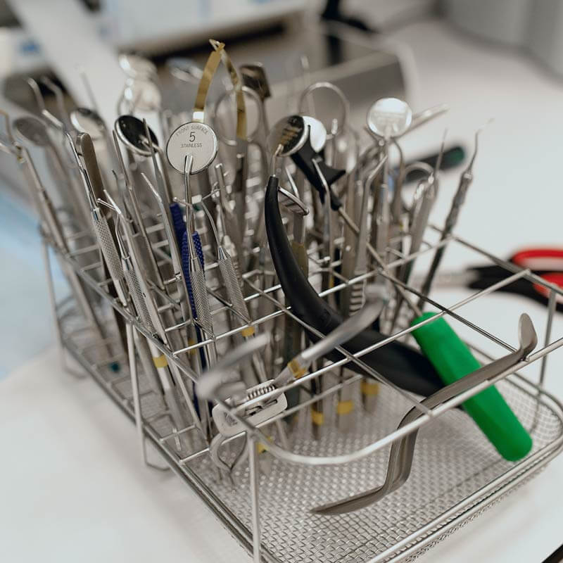 Image of dental tools about to go in the washer