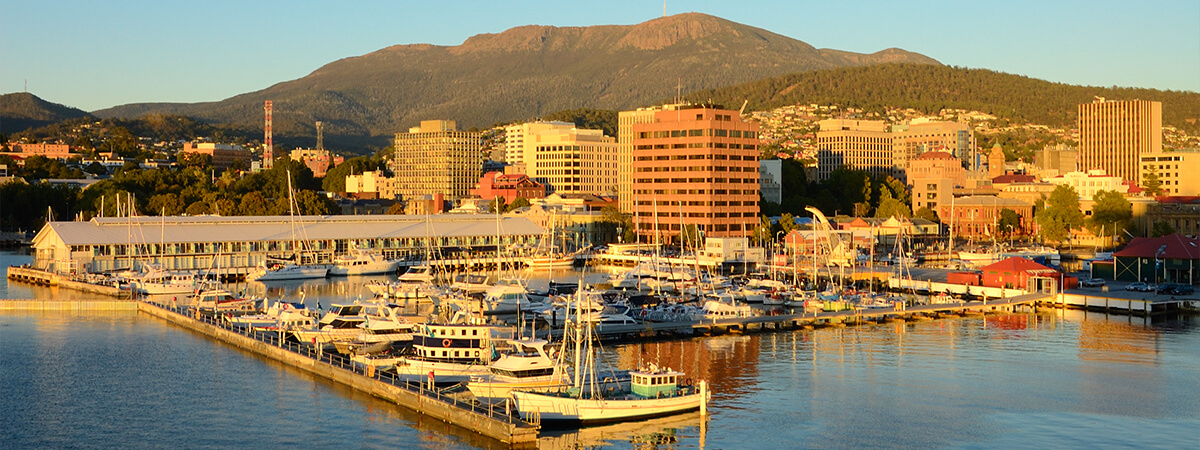 Aerial photo of sunrise of Hobart waterfront with kunyani/Mt Wellington in the background